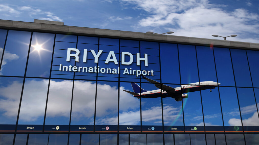 Airplane landing at Riyadh mirrored in terminal
